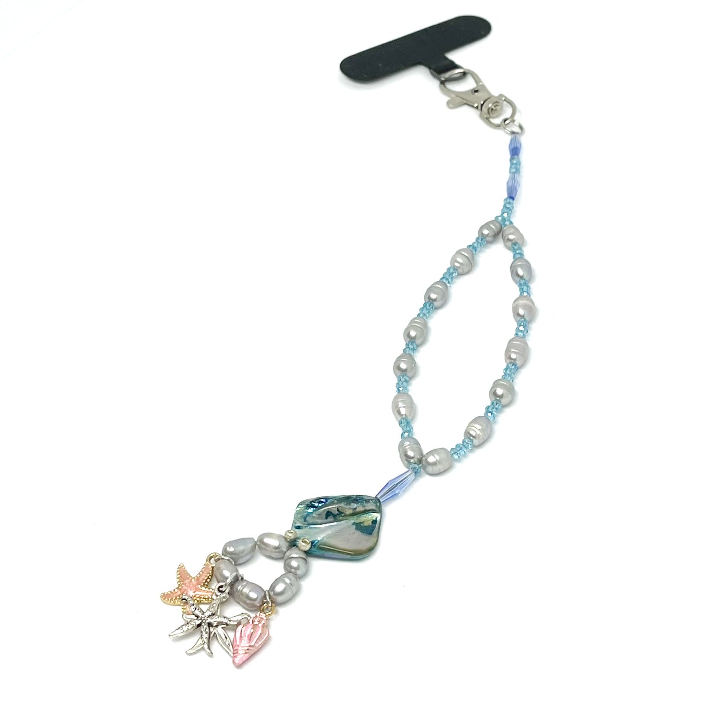 A duplicate photo of a Genuine Lombok Freshwater Pearl Phone Strap - Elegant Silver Handmade Wristlet (21cm). Original Design & One of a kind featuring 3 Sea Trinkets with a black tether.