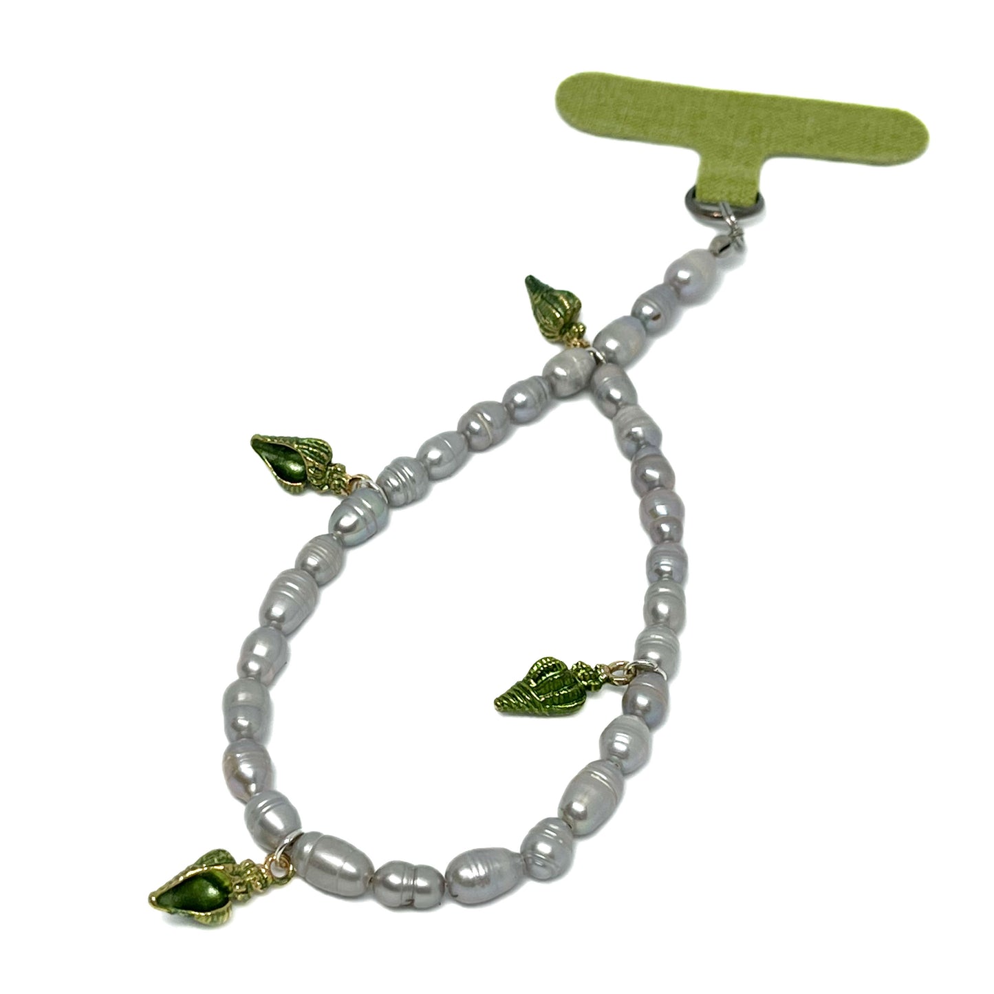 Front Right view of a Genuine Lombok Freshwater Pearl Phone Strap. An Elegant Silver Handmade Wristlet with 4 decorative green shells.