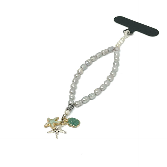 Front right view of a Genuine Lombok Freshwater Pearl Phone Strap - Elegant Silver Handmade Wristlet (17cm). Original Design & One of a kind featuring 2 Starfish and Shell.