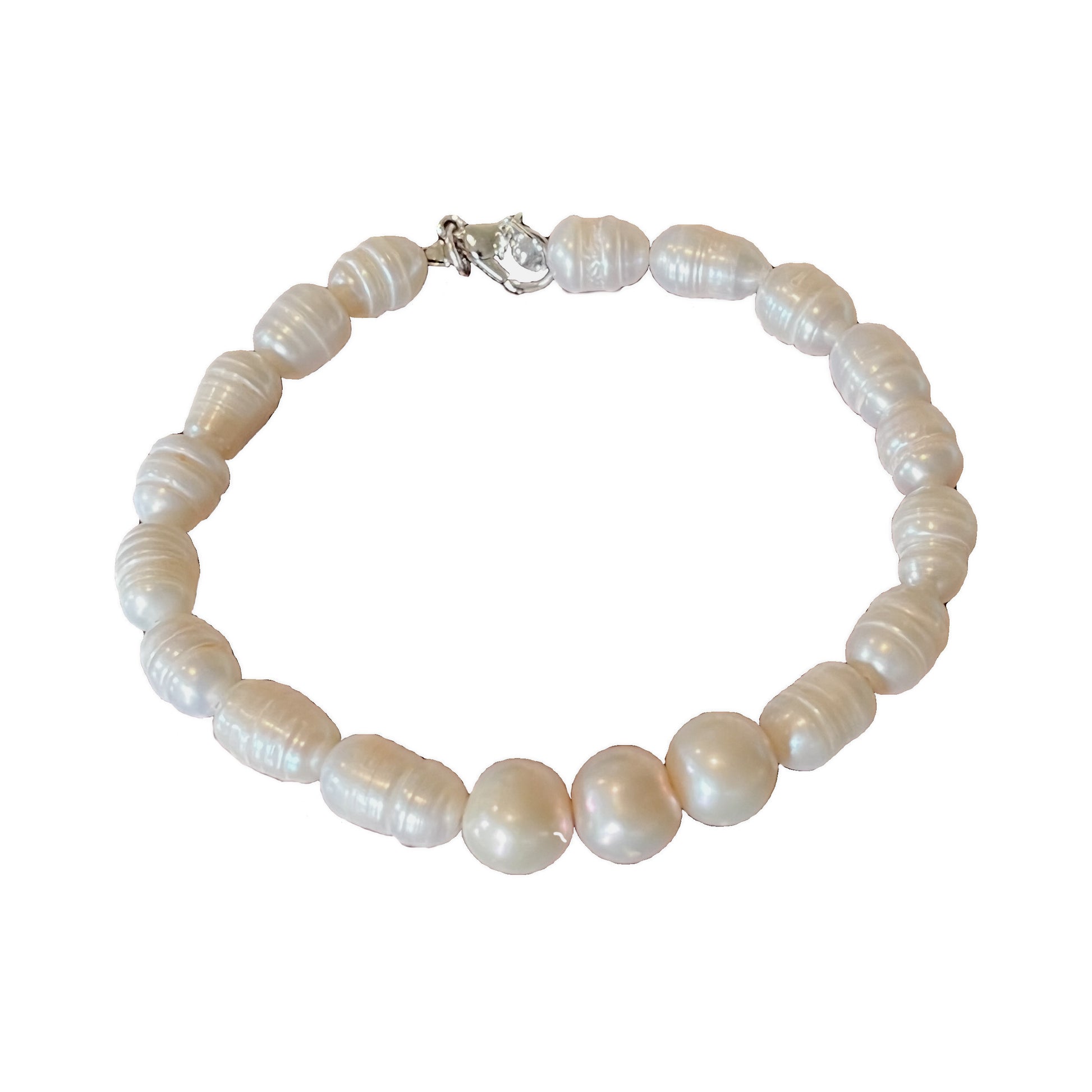 9mm 'A' Quality Freshwater Pearl Bracelet featuring 3 'A' Quality Pearls as a centre piece matched with Baroque Pearls to finish.