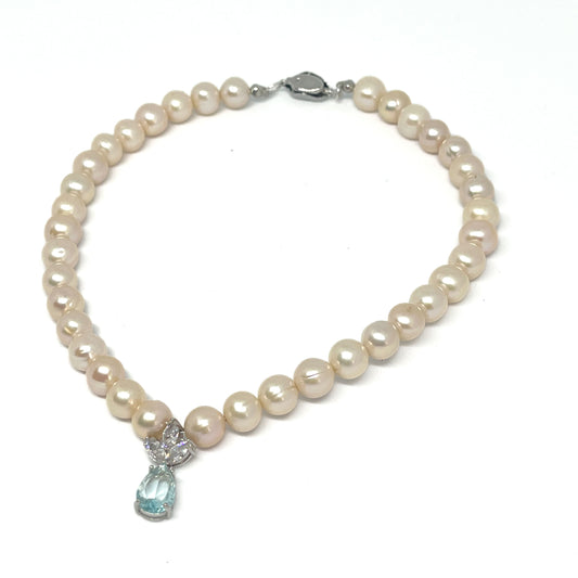 Front right view of 9-10mm AAA Quality Freshwater Culture Pearl Necklace in White with 3 Leaf Swarovski and Aquamarine Pendant