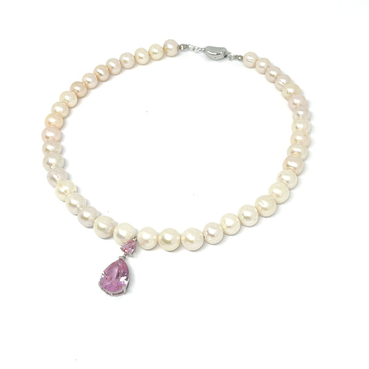 Front Right View of 9-10mm AAA Quality Freshwater Culture Pearl Necklace in White with Elegant Amethyst Tear Drop Pendant.